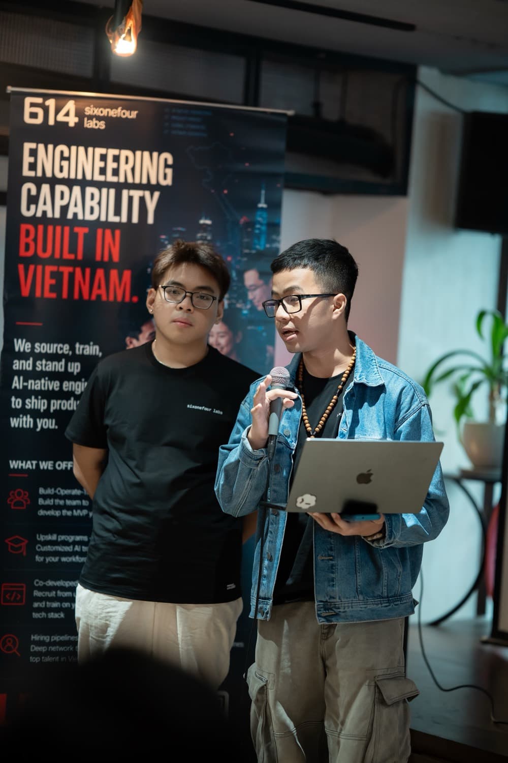 Two sixonefour labs residents presenting their work at a cohort showcase